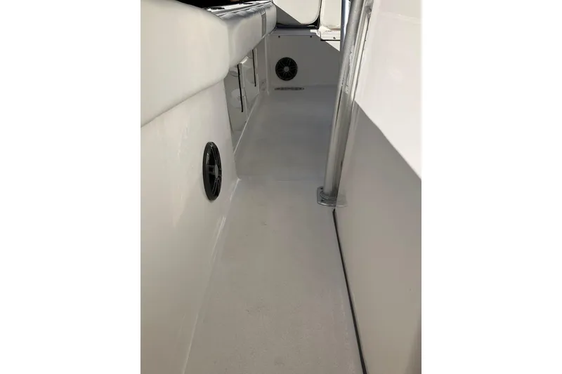 Slide: The Image of 2024 Sea Fox 248 Commander interior walkway with speakers and stainless steel support. - 32
