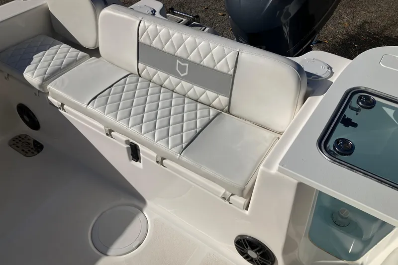 Slide: The Image of 2024 Sea Fox 248 Commander boat interior with quilted seating and storage compartments. - 33