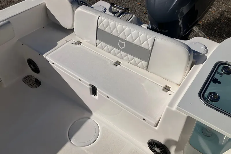 Slide: The Image of 2024 Sea Fox 248 Commander boat interior with cushioned seating and storage. - 34