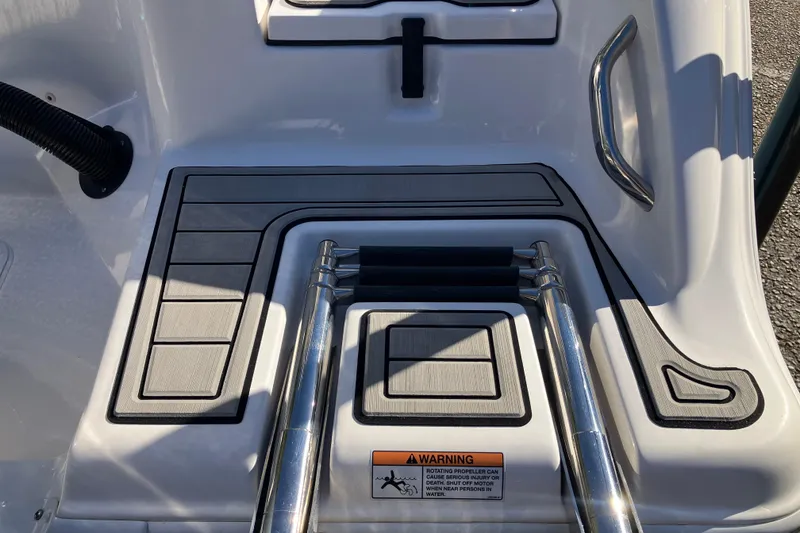 Slide: The Image of 2024 Sea Fox 248 Commander swim platform with ladder and safety warning label. - 8