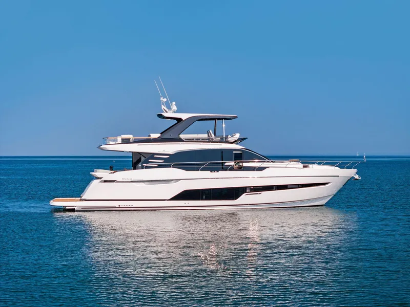 The Image of 2027 Fairline Squadron 68 yacht on calm water, showcasing sleek design and luxury features. - 0