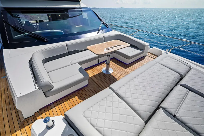 Slide: The Image of Luxury deck of 2024 Fairline Squadron 68 yacht with elegant seating and ocean view. - 10