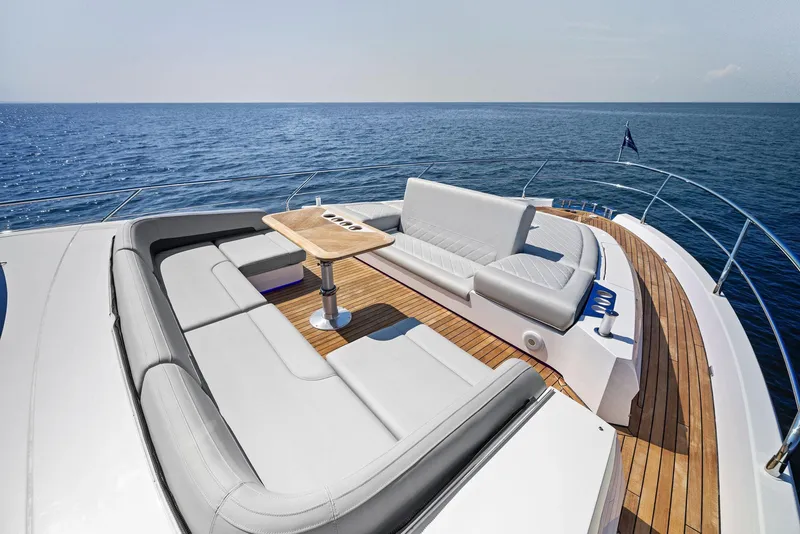 Slide: The Image of Luxury deck of 2024 Fairline Squadron 68 yacht with ocean view. - 11
