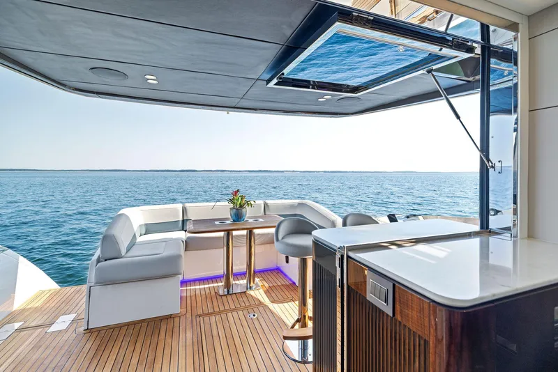 Slide: The Image of Luxurious 2024 Fairline Squadron 68 yacht interior with ocean view and modern seating area. - 16