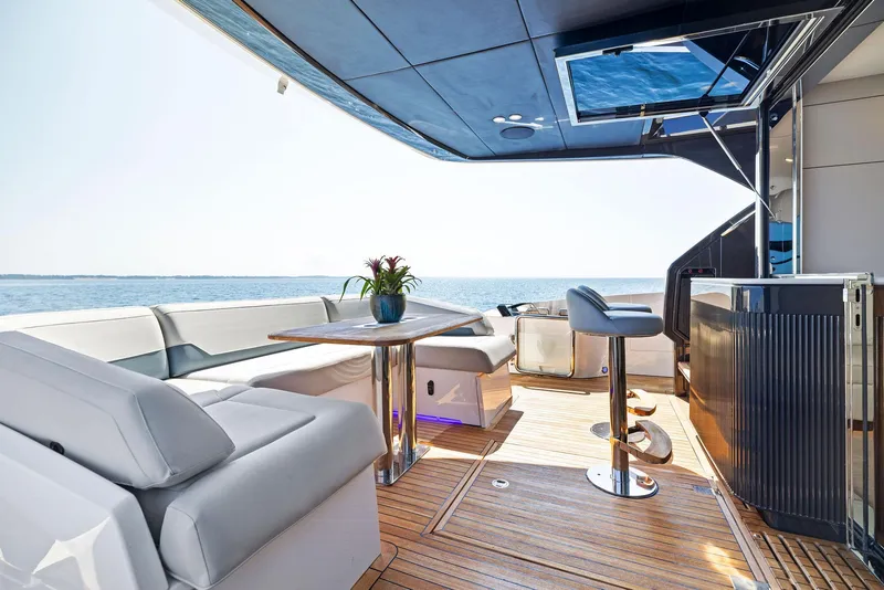 Slide: The Image of Luxurious 2024 Fairline Squadron 68 yacht deck with modern seating and ocean view. - 17