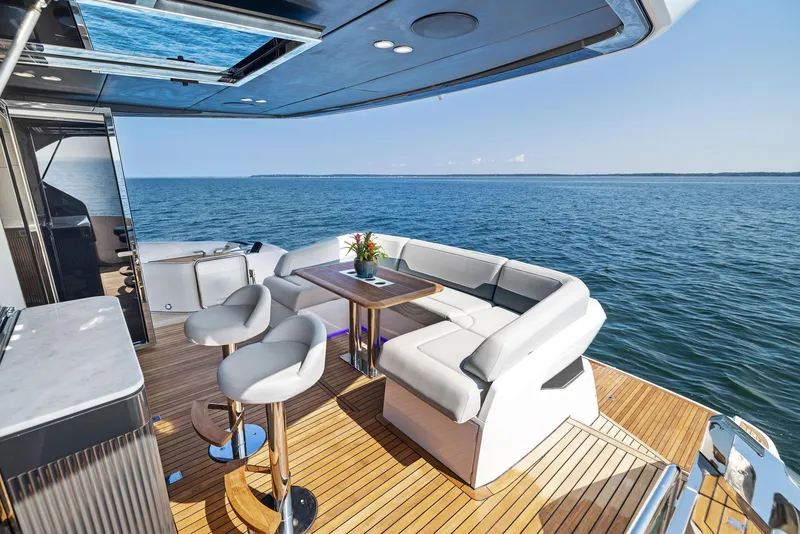 Slide: The Image of Luxury deck of 2024 Fairline Squadron 68 yacht with ocean view. - 20