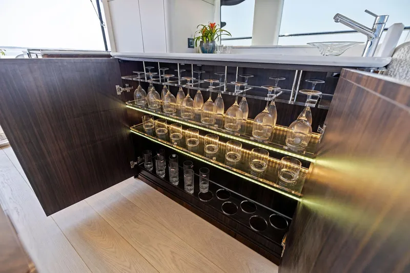 Slide: The Image of Luxury yacht bar cabinet with glassware, Fairline 2024 Squadron 68. - 25