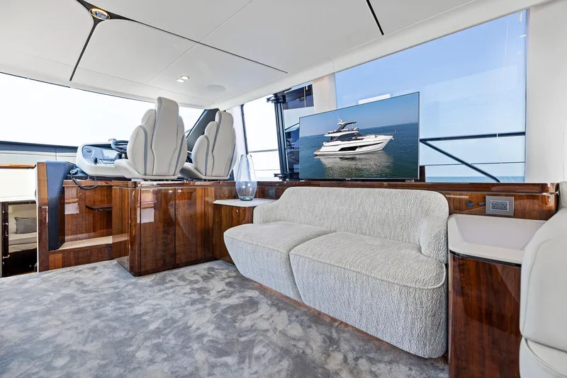 Slide: The Image of Luxurious interior of 2024 Fairline Squadron 68 yacht with plush seating and modern design. - 29