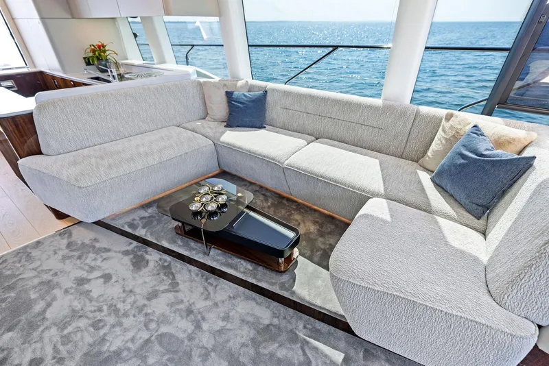 Slide: The Image of Luxurious interior of 2024 Fairline Squadron 68 yacht with plush seating and ocean view. - 30
