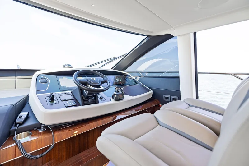 Slide: The Image of Luxurious interior of 2024 Fairline Squadron 68 yacht helm station. - 31