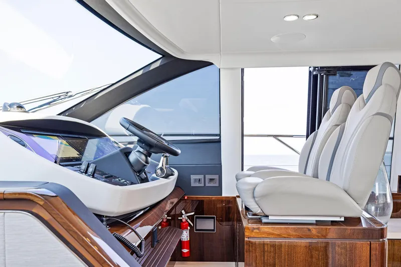 Slide: The Image of Interior of 2024 Fairline Squadron 68 yacht with modern helm and seating. - 32