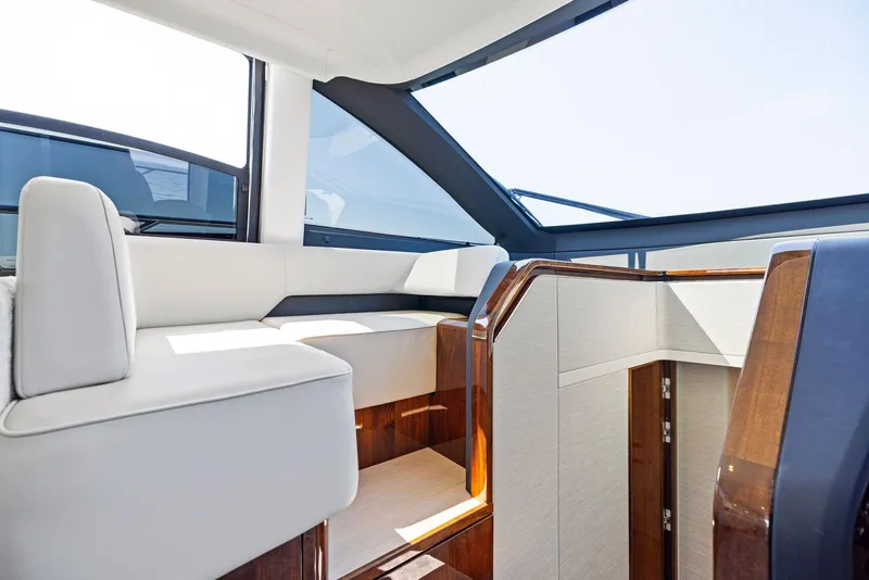 Slide: The Image of Interior of 2024 Fairline Squadron 68 yacht, featuring modern seating and sleek design. - 34