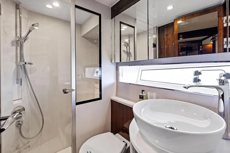 Slide: The Image of Luxurious bathroom in 2024 Fairline Squadron 68 yacht with modern fixtures and elegant design. - 38