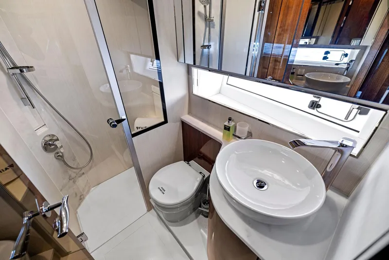 Slide: The Image of Luxurious bathroom in 2024 Fairline Squadron 68 yacht with modern fixtures and shower. - 39