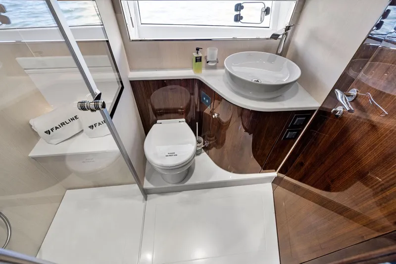 Slide: The Image of Luxurious bathroom in 2027 Fairline Squadron 68 yacht with modern fixtures and elegant design. - 40