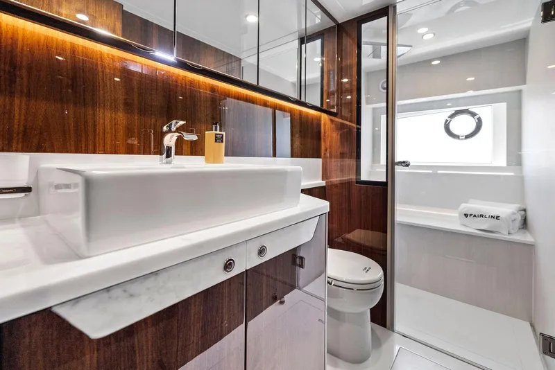 Slide: The Image of Luxurious bathroom in 2027 Fairline Squadron 68 yacht with modern fixtures and elegant wood finishes. - 46