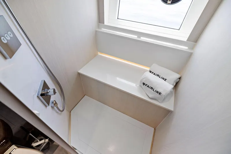 Slide: The Image of Luxurious bathroom in 2027 Fairline Squadron 68 yacht with modern shower and branded towels. - 48