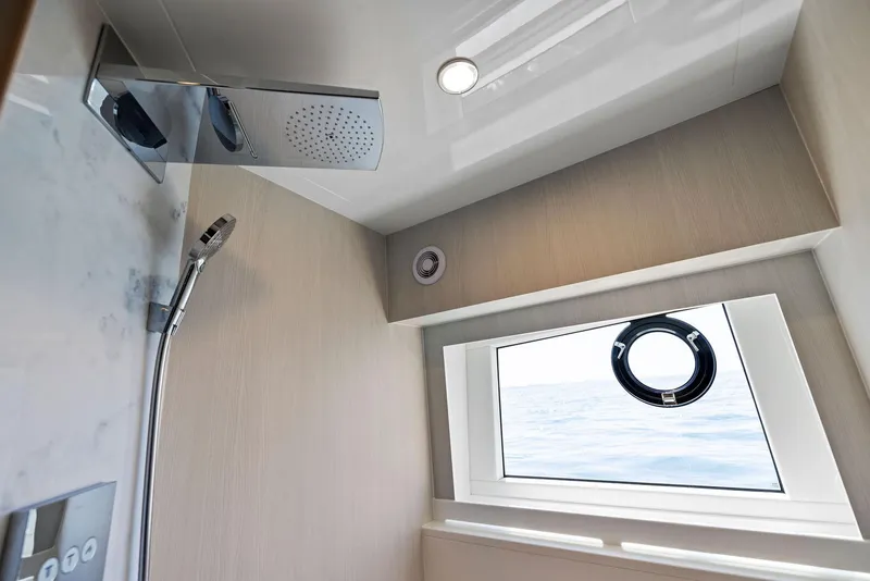 Slide: The Image of Modern shower area in 2027 Fairline Squadron 68 yacht with ocean view window. - 49