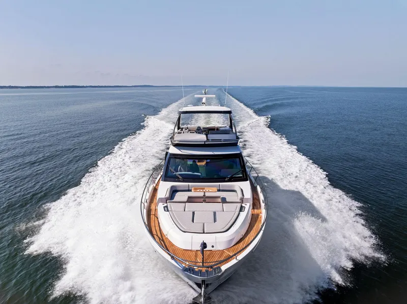 Slide: The Image of Fairline 2024 Squadron 68 yacht cruising on open water, showcasing sleek design and powerful performance. - 5