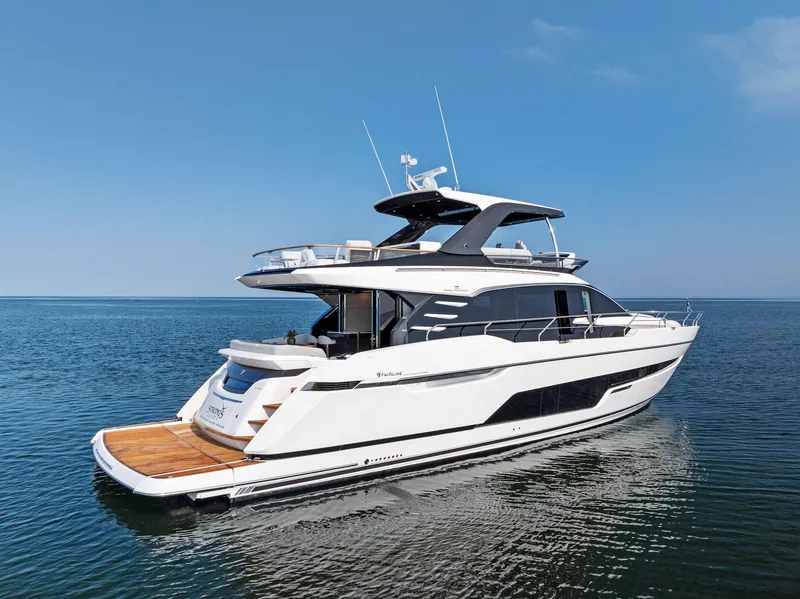 Slide: The Image of 2027 Fairline Squadron 68 luxury yacht on calm blue water. - 6