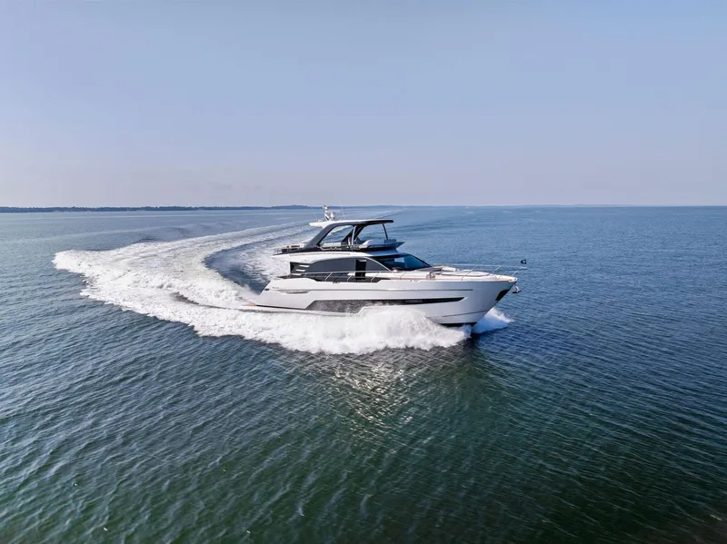 Slide: The Image of 2024 Fairline Squadron 68 yacht cruising on open water. - 7