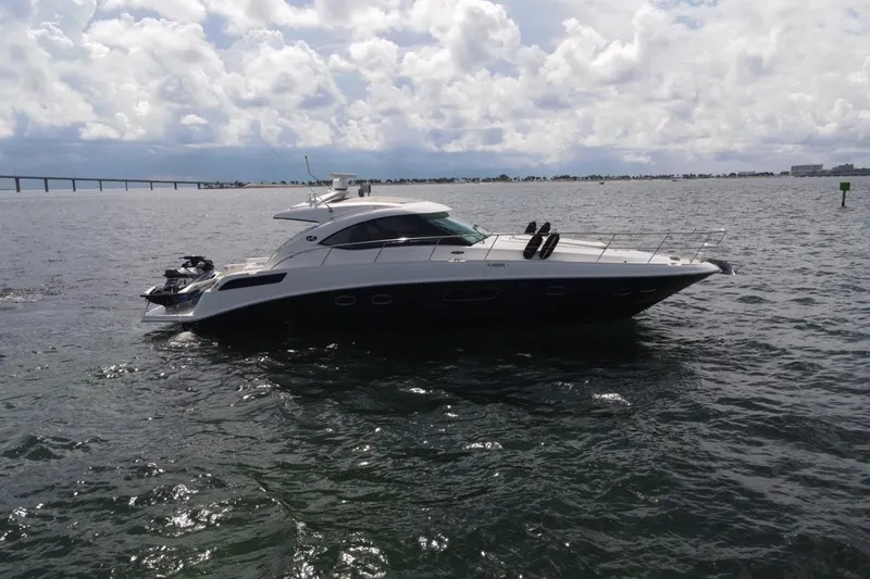 Slide: The Image of Luxury 2011 Sea Ray 470 Sundancer yacht cruising on open water. - 13