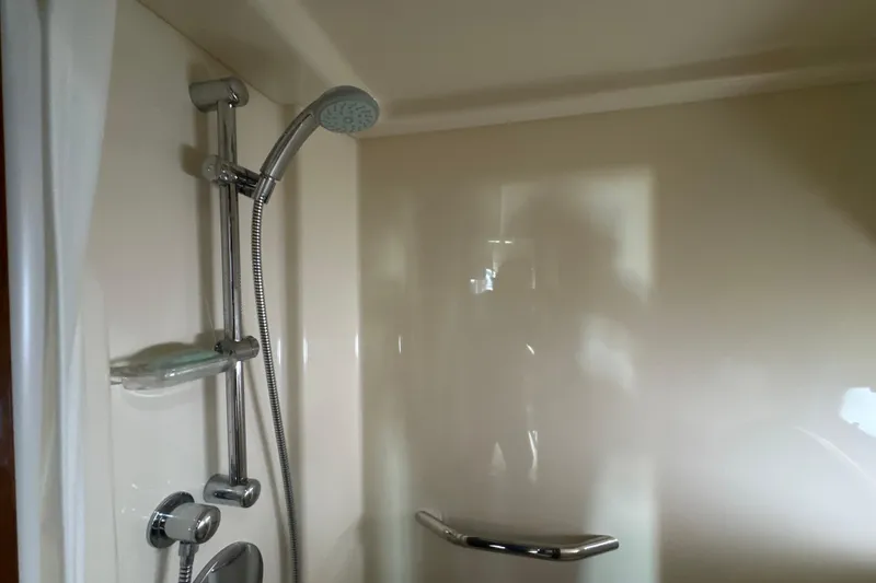 Slide: The Image of Shower area in 2011 Sea Ray 470 Sundancer yacht, featuring modern fixtures. - 20