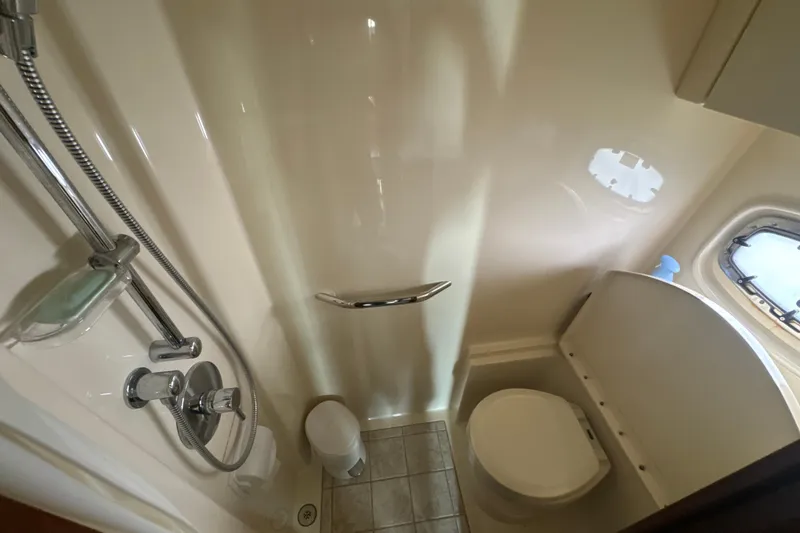 Slide: The Image of Bathroom interior of 2011 Sea Ray 470 Sundancer yacht with shower and toilet. - 21