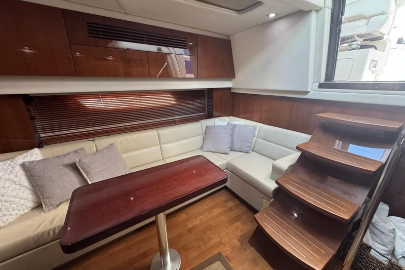 Slide: The Image of Luxurious interior of 2011 Sea Ray 470 Sundancer yacht with elegant seating and wooden finishes. - 34