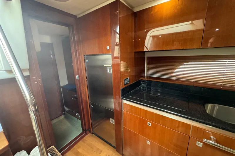 Slide: The Image of Luxurious 2011 Sea Ray 470 Sundancer yacht interior with sleek kitchen design. - 35