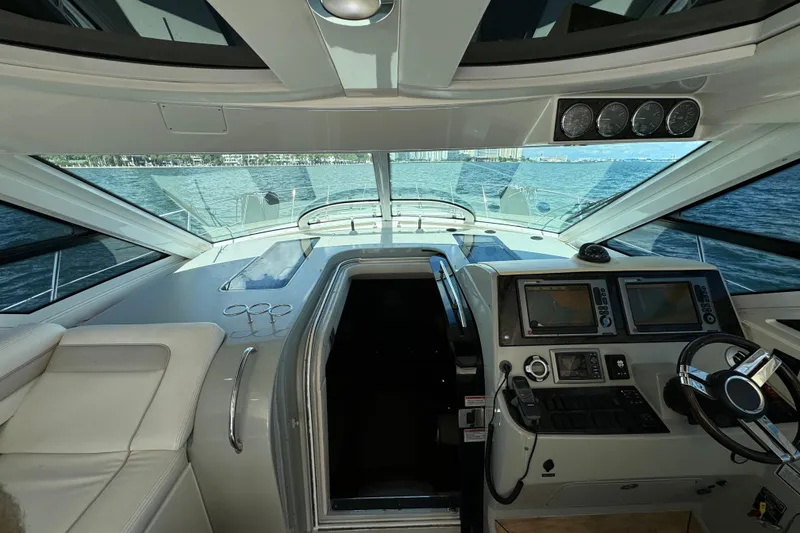 Slide: The Image of Interior view of 2011 Sea Ray 470 Sundancer yacht cockpit with navigation equipment. - 48