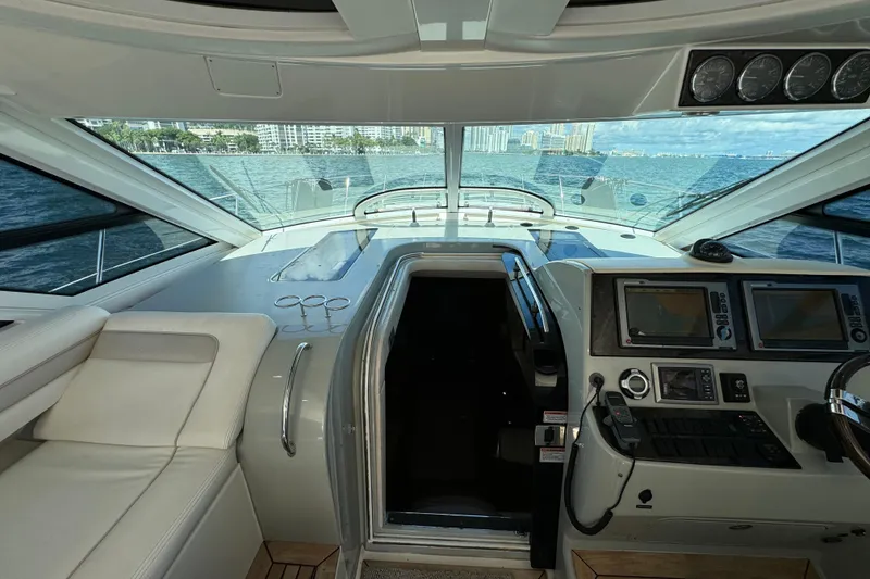Slide: The Image of Interior view of 2011 Sea Ray 470 Sundancer yacht cockpit with navigation equipment. - 49