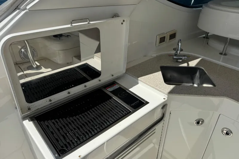 Slide: The Image of 2011 Sea Ray 470 Sundancer yacht kitchen with grill and sink. - 55