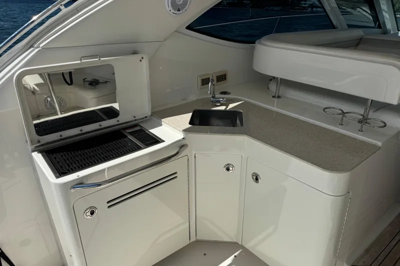Slide: The Image of Luxurious 2011 Sea Ray 470 Sundancer yacht kitchenette with grill and sink. - 57