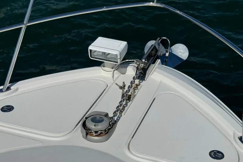 Slide: The Image of Bow of 2011 Sea Ray 470 Sundancer with anchor and spotlight. - 62