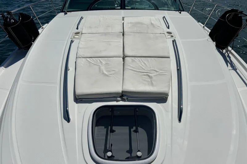 Slide: The Image of 2011 Sea Ray 470 Sundancer yacht deck with sunbathing cushions and ocean view. - 70