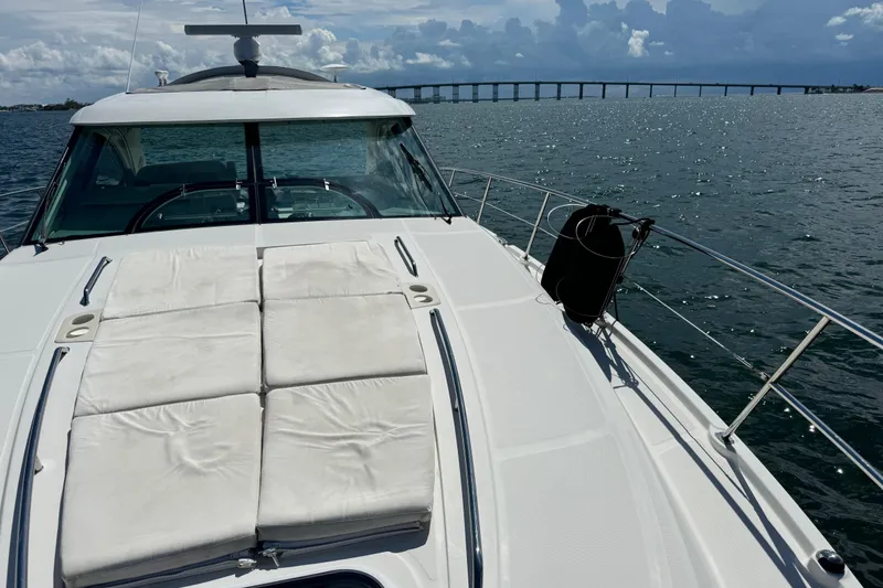 Slide: The Image of 2011 Sea Ray 470 Sundancer yacht on open water with bridge in background. - 71
