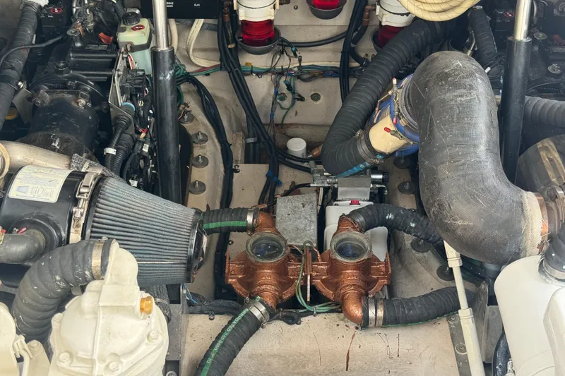 Slide: The Image of Engine compartment of a 2011 Sea Ray 470 Sundancer boat, showcasing mechanical components. - 97