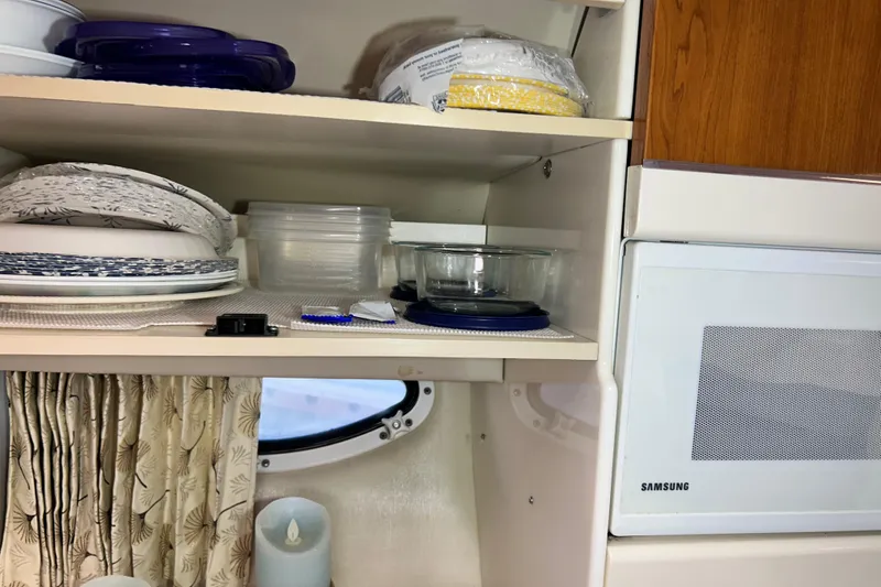 Slide: The Image of Over the sink cabinet storage. - 17