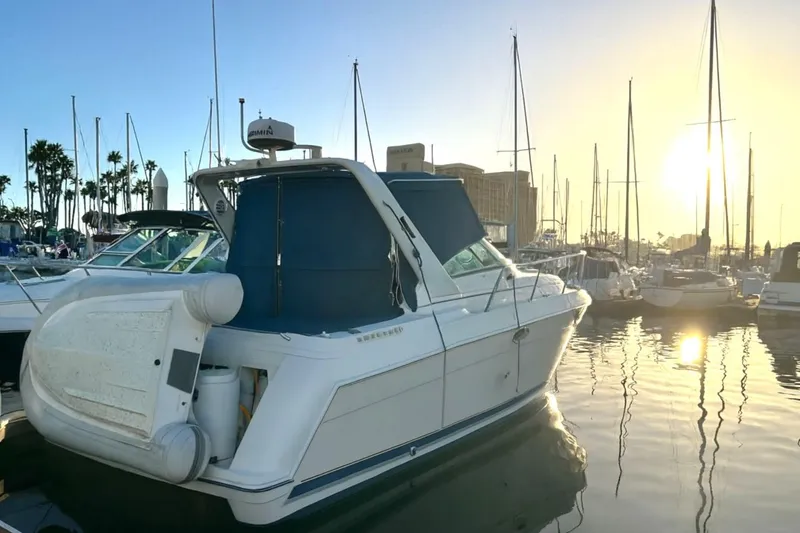 Slide: The Image of 2000 Formula 31 Performance Cruiser docked at sunset in a marina. - 6