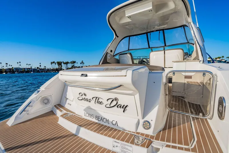 Slide: The Image of 2016 Sea Ray 370 Express Cruiser docked in Long Beach, CA, with clear blue skies. - 12