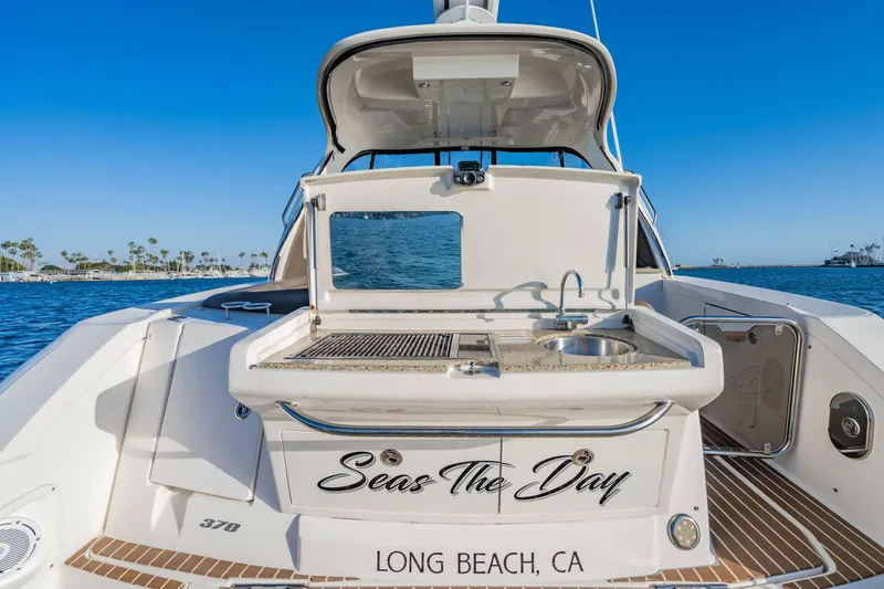 Slide: The Image of 2016 Sea Ray 370 Express Cruiser with outdoor kitchen, docked in Long Beach, CA. - 13