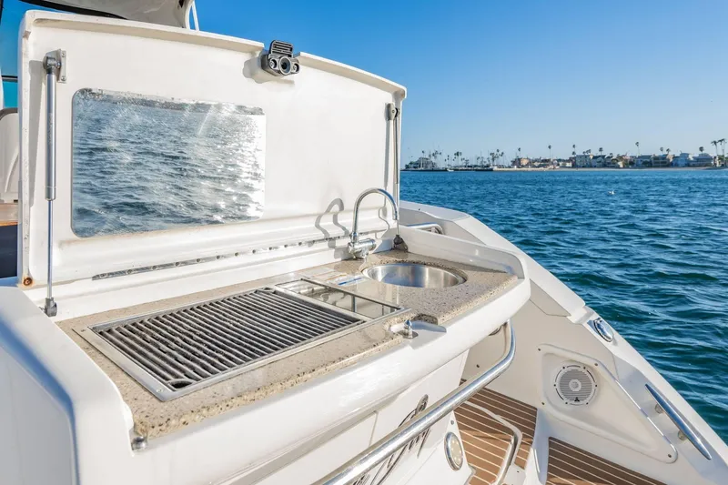Slide: The Image of Outdoor kitchen on 2016 Sea Ray 370 Express Cruiser yacht with ocean view. - 14