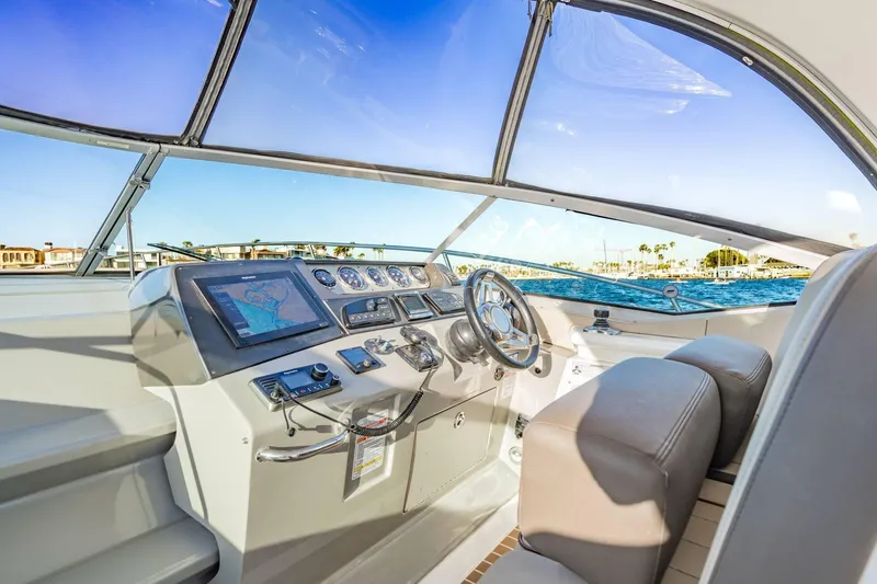 Slide: The Image of Helm of 2016 Sea Ray 370 Express Cruiser with navigation system and ocean view. - 21
