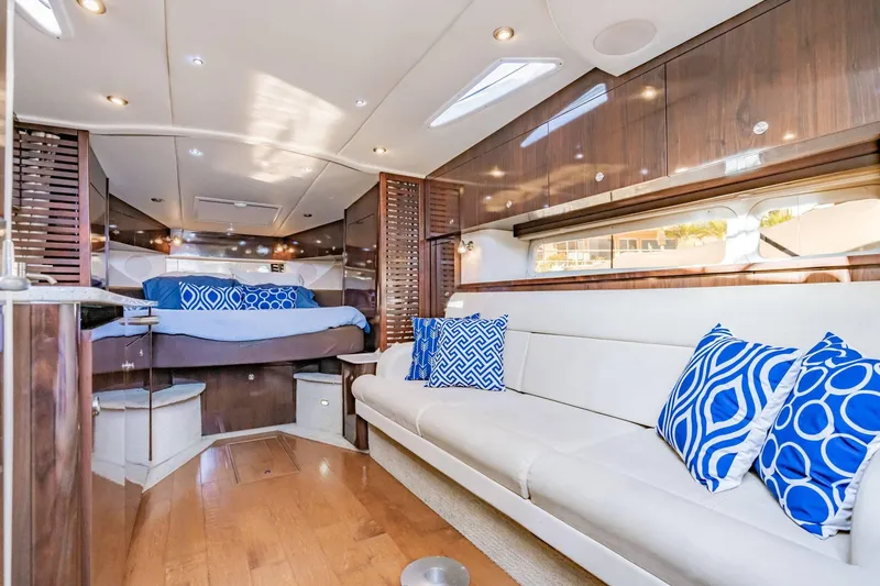 Slide: The Image of Luxurious interior of 2016 Sea Ray 370 Express Cruiser with elegant seating and bedding. - 34