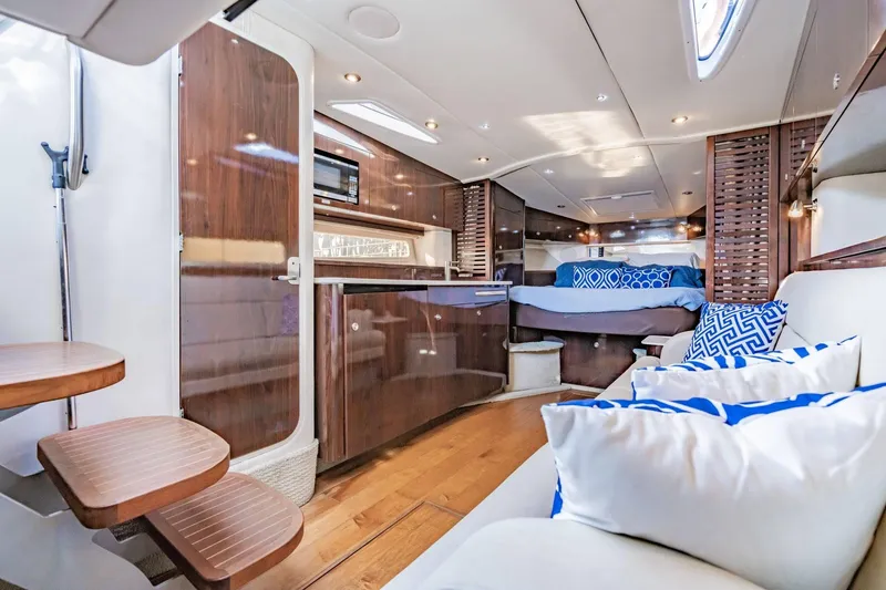 Slide: The Image of Luxurious interior of 2016 Sea Ray 370 Express Cruiser with modern amenities and stylish decor. - 36