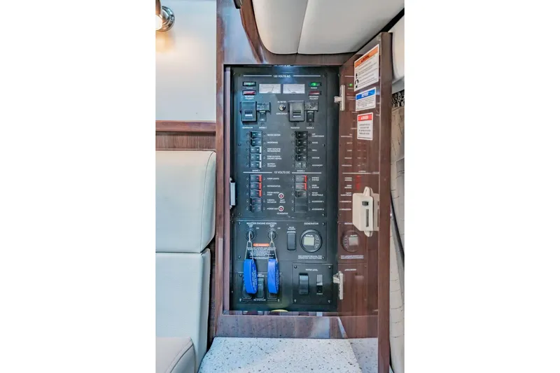 Slide: The Image of Electrical control panel on a 2016 Sea Ray 370 Express Cruiser boat. - 53