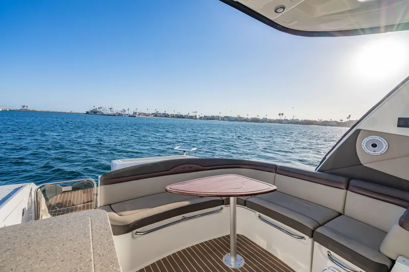 Slide: The Image of Luxurious 2016 Sea Ray 370 Express Cruiser with elegant seating and ocean view. - 17