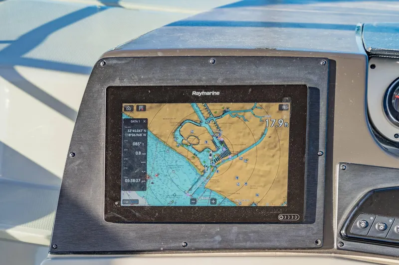 Slide: The Image of Raymarine navigation display on 2016 Sea Ray 370 Express Cruiser dashboard. - 25