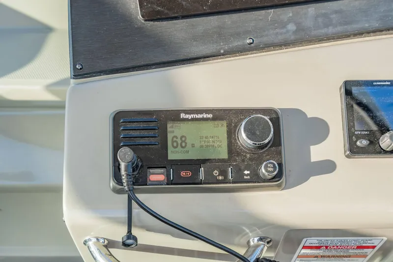 Slide: The Image of Raymarine control panel on 2016 Sea Ray 370 Express Cruiser dashboard. - 26